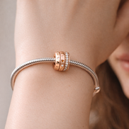 Rose Pandora Spacer - Rose-Gold-Plated Pandora Crystal Spacer — worn on wrist