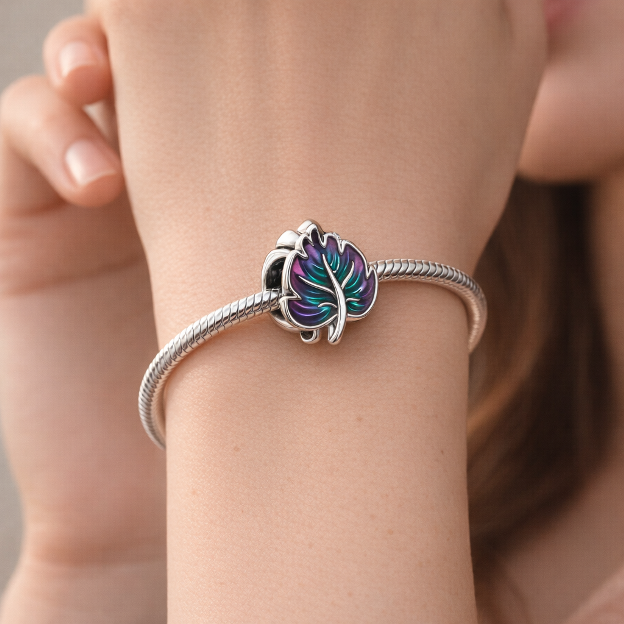 Iridescent Leaf Charm - Purple Teal Leaf Charm — worn on wrist