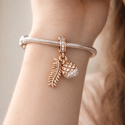 Rose Feather Acorn Dangle - Rose-Gold-Plated Feather and Acorn Dangle — worn on wrist