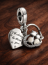 Cats & Hearts Dangle Charm — display on walnut