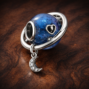 Blue Planet Dangle - Blue Planet Moon Dangle Charm — display on walnut