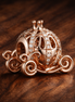 Disney Cinderella Sparkling Carriage Charm — display on walnut