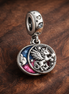 Unicorn Moon Dangle - Unicorn Crescent Moon Dangle — display on walnut