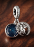 Sun Moon Orbit Dangle Charm - Sun Moon Orbit Dangle Charm — display on walnut