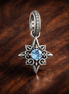 Blue North Star Dangle Charm - Blue North Star Dangle Charm — display on walnut