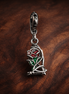 Disney Beauty and the Beast Enchanted Rose Dangle Charm — display on walnut