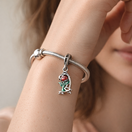 Disney Beauty and the Beast Enchanted Rose Dangle Charm — worn on wrist
