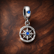 Blue Compass Dangle Charm - Blue Compass Dangle Charm — display on walnut