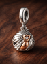 Angel Wing Heart Dangle Charm - Angel Wing Heart Dangle Charm — display on walnut