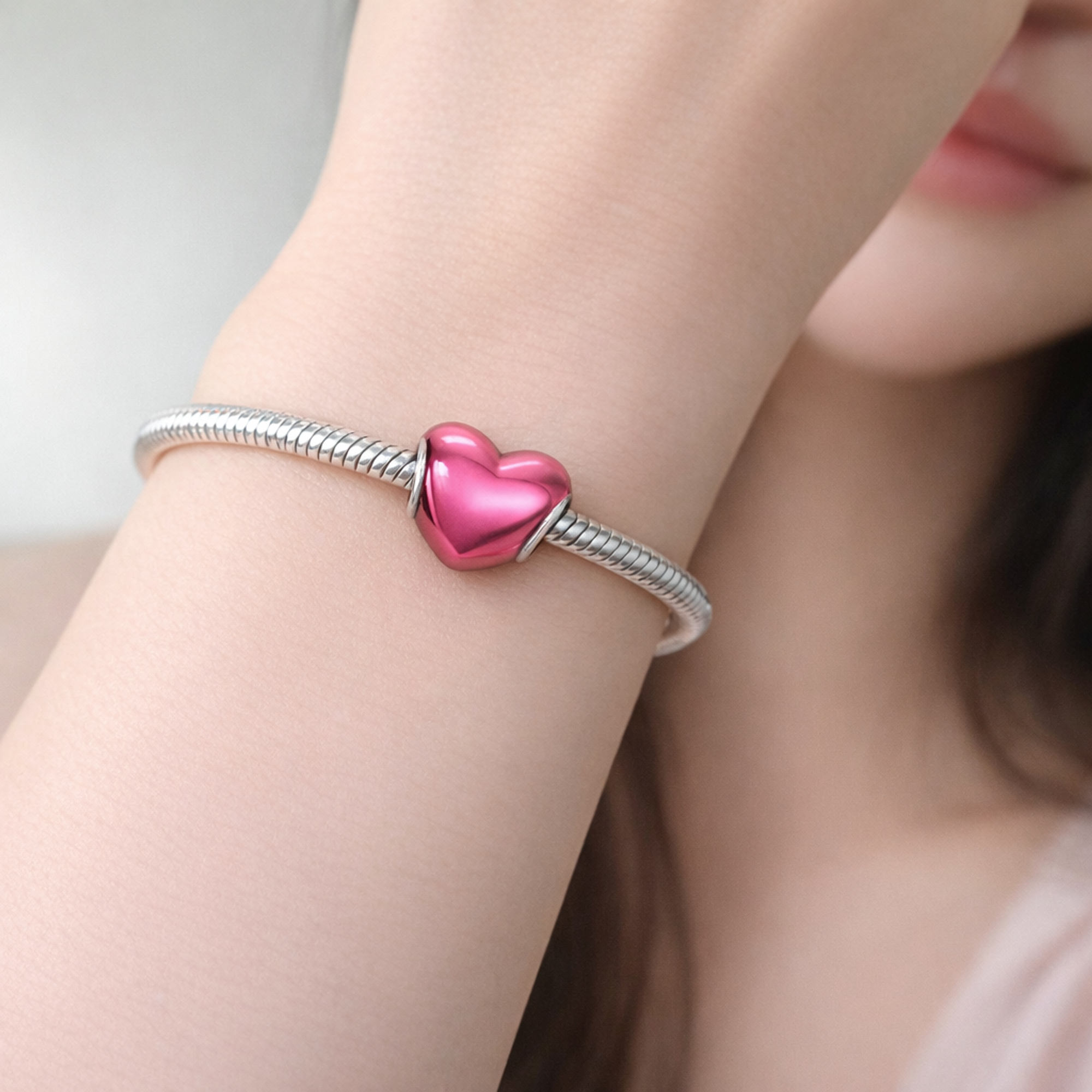Metallic Pink Heart Charm — worn on wrist