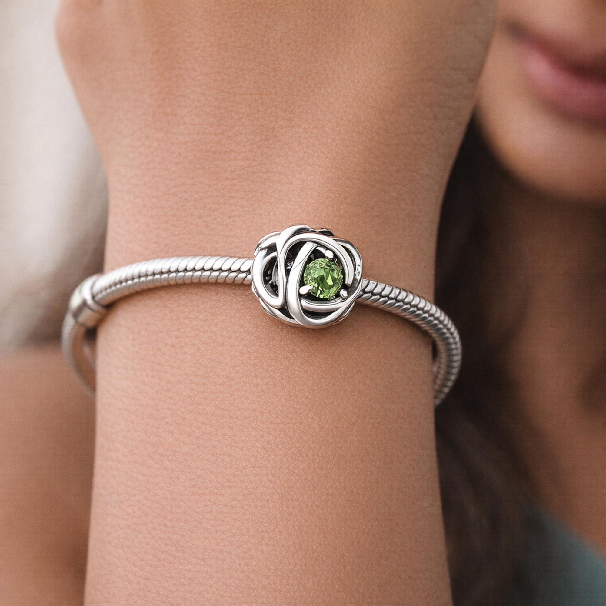 August Spring Green Eternity Circle Charm — worn on wrist
