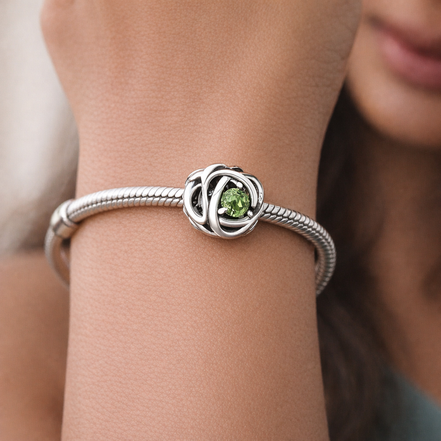 August Spring Green Eternity Circle Charm — worn on wrist