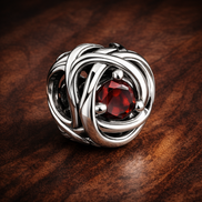 July True Red Eternity Circle Charm — display on walnut