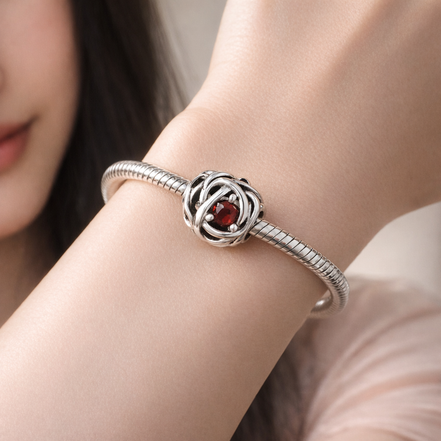 July True Red Eternity Circle Charm — worn on wrist