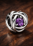 February Purple Eternity Circle Charm — display on walnut