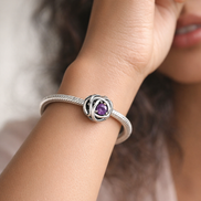 February Purple Eternity Circle Charm — worn on wrist