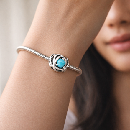 December Turquoise Blue Eternity Circle Charm — worn on wrist