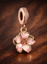 Cherry Blossom Dangle Charm — display on walnut