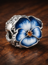 Blue Pansy Flower Charm — display on walnut