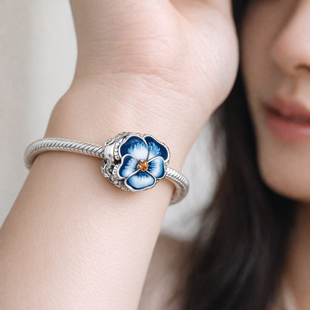 Blue Pansy Flower Charm — worn on wrist