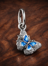 Blue Butterfly & Quote Double Dangle Charm — display on walnut