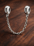 Silver Beaded Safety Chain Charm - Silver Beaded Safety Chain Charm — display on walnut