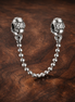 Silver Ball Safety Chain Charm - Silver Ball Safety Chain Charm — display on walnut
