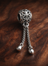 Leaf Tassel Safety Chain Charm - Leaf Tassel Safety Chain Charm — display on walnut