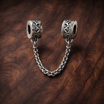 Silver Logo Safety Chain Charm - Silver Logo Safety Chain Charm — display on walnut