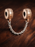 Rose Silver Logo Safety Chain Charm - Rose Silver Logo Safety Chain Charm — display on walnut