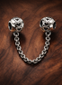 Silver Swirl Safety Chain Charm - Silver Swirl Safety Chain Charm — display on walnut