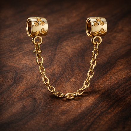 Gold Plated Bead Safety Chain Charm - Gold Plated Bead Safety Chain Charm — display on walnut