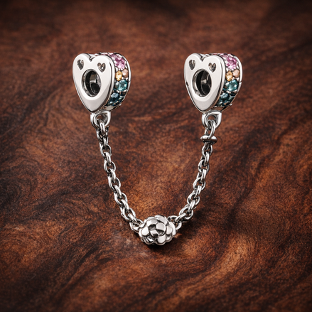 Rainbow Arc Safety Chain Charm - Rainbow Arc Safety Chain Charm — display on walnut