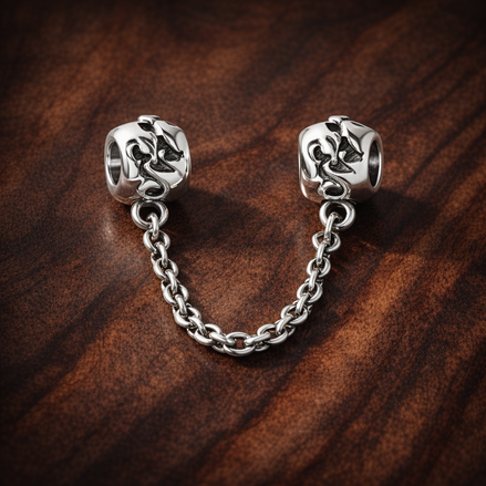 Sparkle Drop Safety Chain Charm - Sparkle Drop Safety Chain Charm — display on walnut