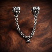 Silver Floral Safety Chain Charm - Silver Floral Safety Chain Charm — display on walnut