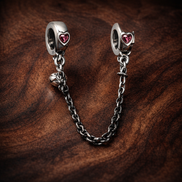 Pink Heart Safety Chain Charm - Pink Heart Safety Chain Charm — display on walnut