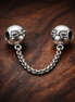 Bow Safety Chain Charm - Bow Safety Chain Charm — display on walnut
