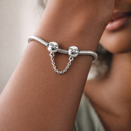 Bow Safety Chain Charm - Bow Safety Chain Charm — worn on wrist