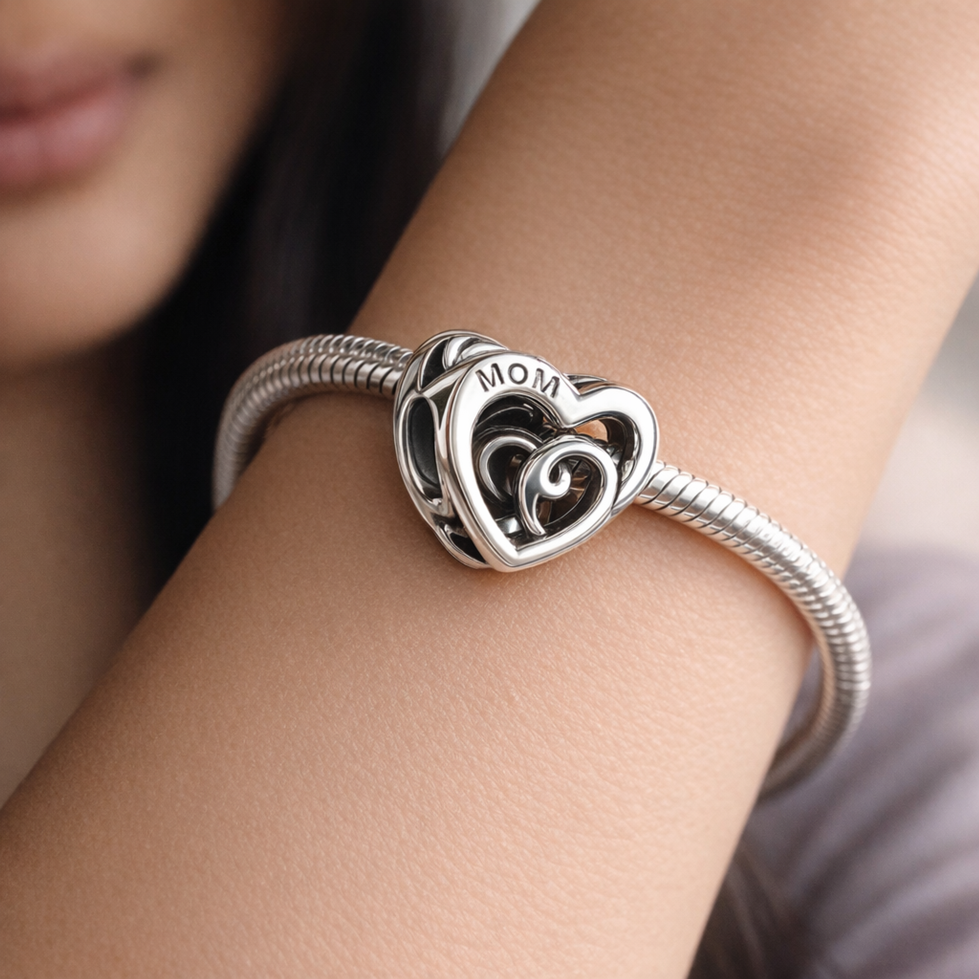 Entwined Infinite Hearts Charm — worn on wrist