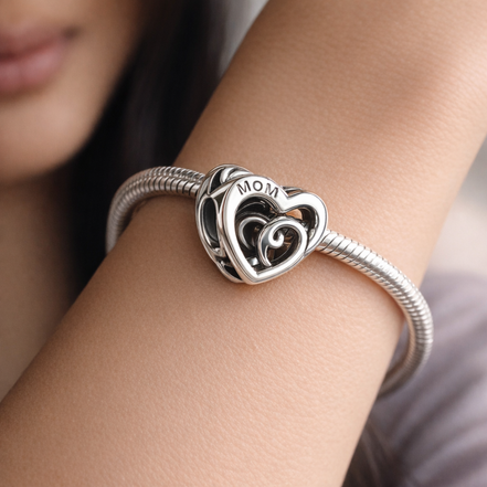 Entwined Infinite Hearts Charm — worn on wrist