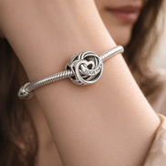 Family Always Encircled Heart Charm — worn on wrist