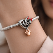 Disney Minnie Mouse Mom Heart Charm — worn on wrist