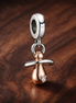 Baby Pacifier Dangle Charm — display on walnut