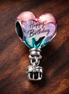 Happy Birthday Hot Air Balloon Charm — display on walnut