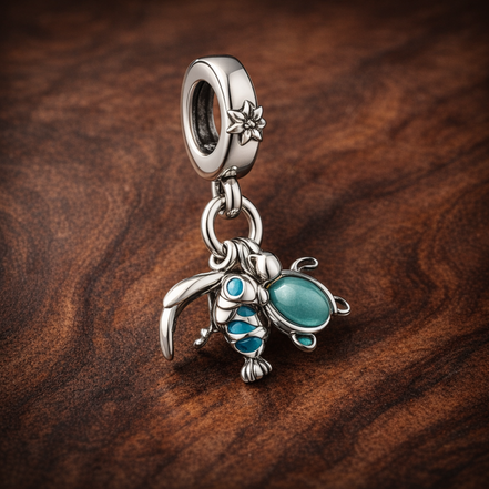 Fish, Sea Turtle & Conch Triple Dangle Charm — display on walnut