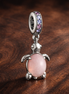Pink Turtle Dangle Charm - Pink Turtle Dangle Charm — display on walnut