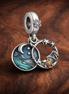 Ocean Wave Double Dangle Charm - Ocean Wave Double Dangle Charm — display on walnut