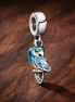 Colourful Parrot - Sterling Silver Colourful Enamel Parrot Dangle Charm — display on walnut
