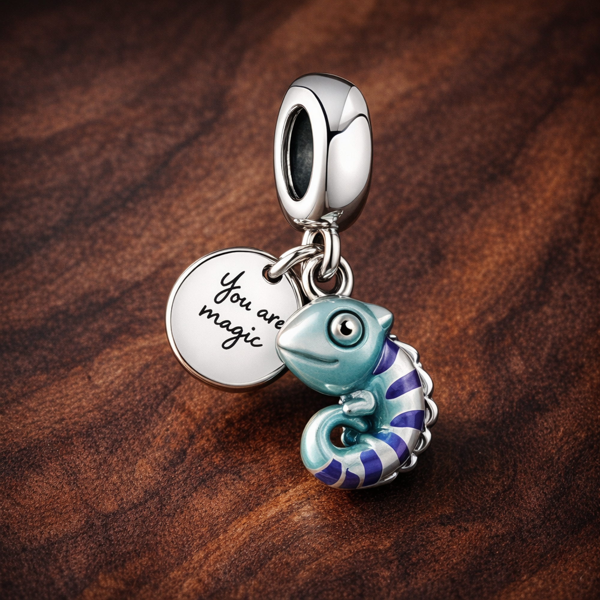 Color-changing Chameleon Dangle Charm — display on walnut