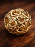 Openwork Heart Charm — display on walnut